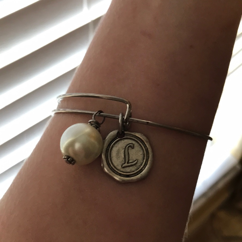 Silver braclet with initials “L”